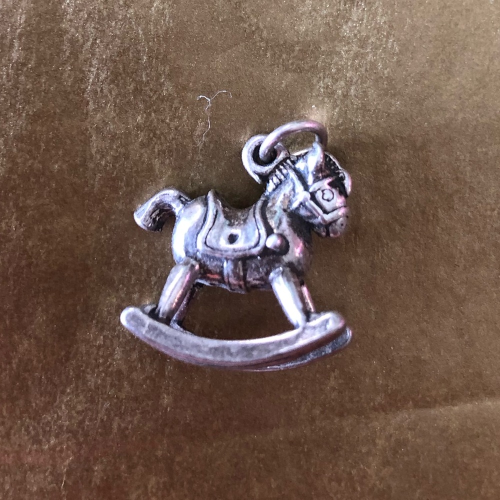 Sterling silver rocking horse charm.